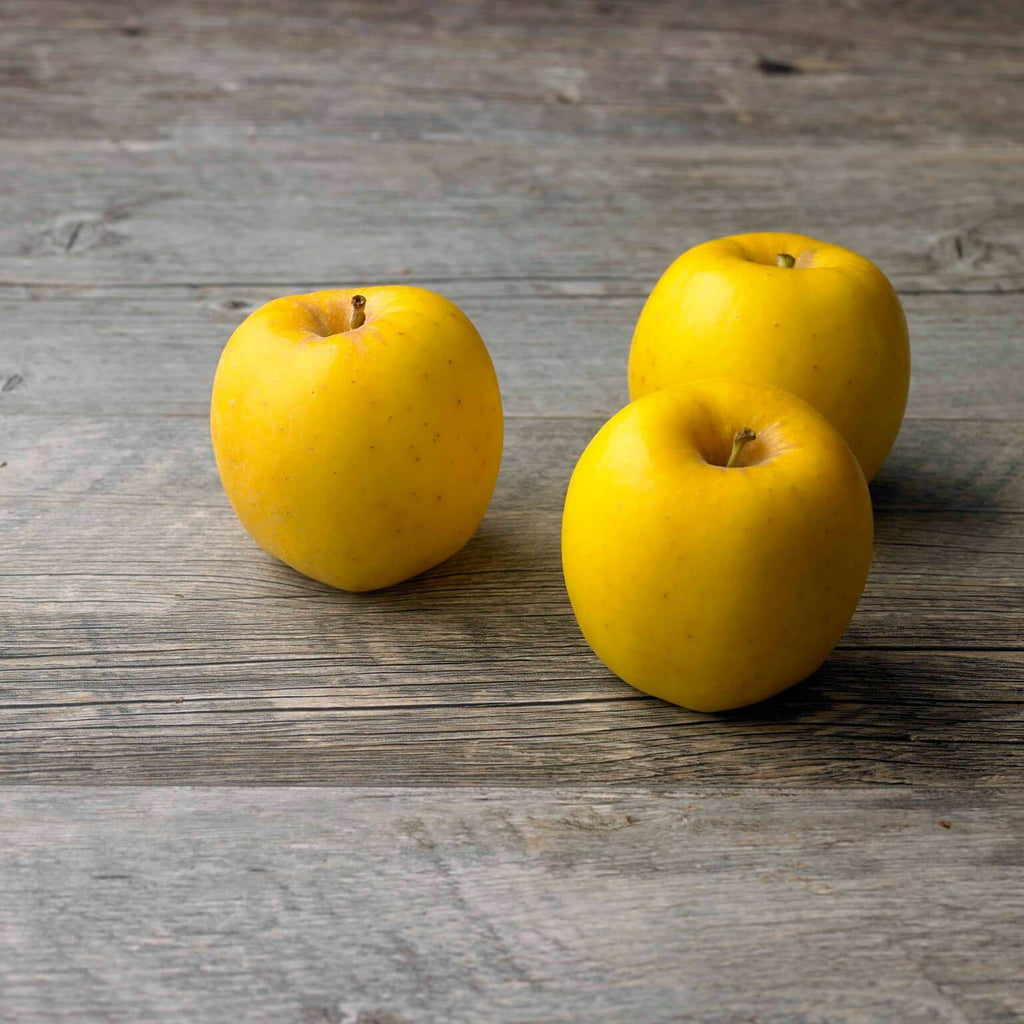 Raw Yellow Organic Opal Apples Ready to Eat Stock Photo - Alamy