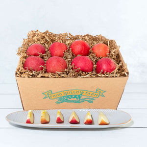 A square image featuring a rustic craft gift basket filled with elegant apples, highlighting their crisp texture.
